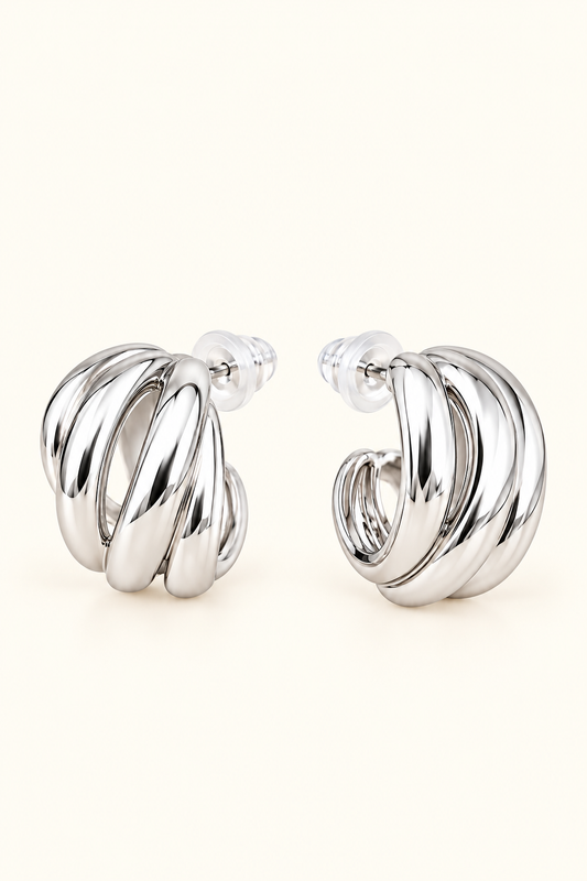 Sienna Sculpted silver hoop earrings on soft ivory cream background