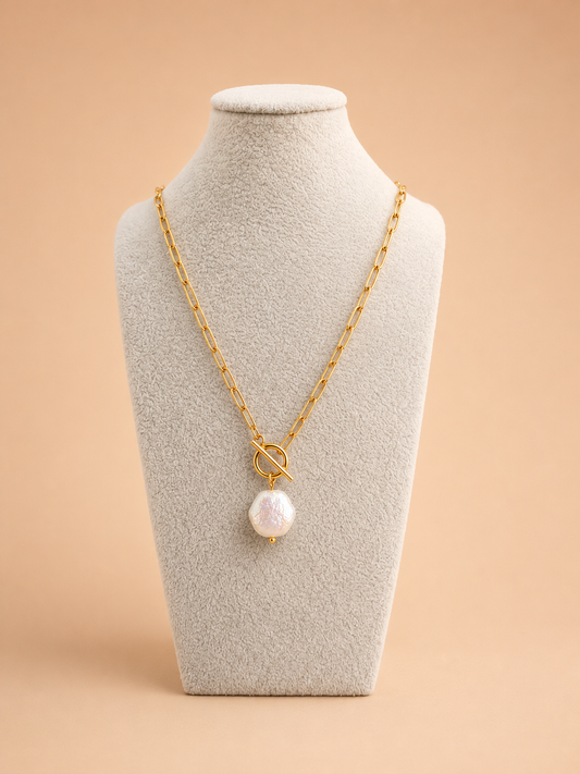 Front view of the Valoria London Elara gold paperclip necklace with statement toggle and luminous pearl-effect pendant