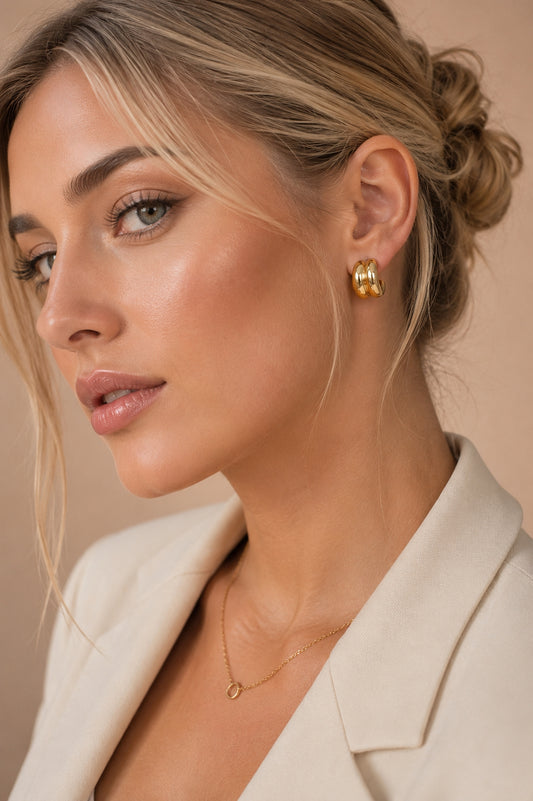 Model wearing Aurelia Double Ridge 18K Gold Plated Hoop Earrings by Valoria London