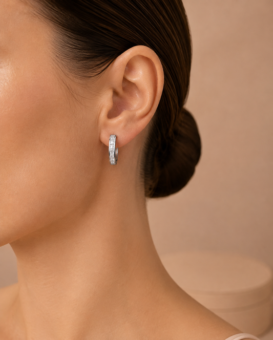 Model wearing Amélie crystal channel hoop earrings by Valoria London
