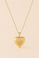 Amora textured gold heart pendant necklace on soft ivory cream background