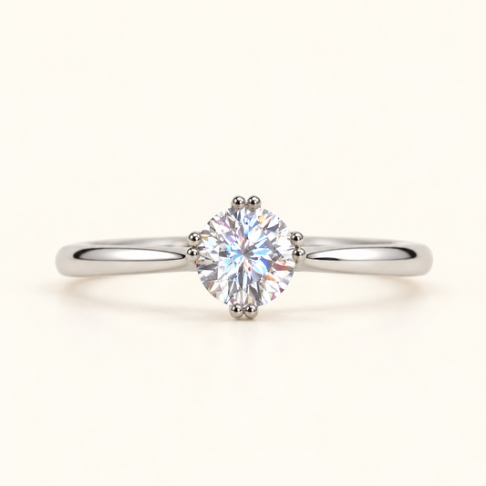 Aurelia round solitaire ring with brilliant round-cut centre stone and polished silver-tone band