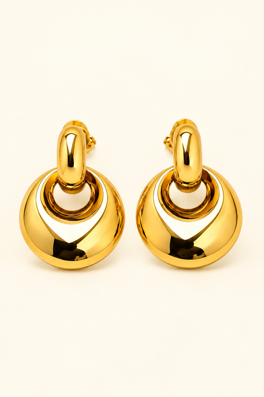 Aurelia Sculpted Crescent Hoop Earrings in polished gold tone on soft ivory cream background