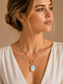 Model wearing Celestia opal toggle pendant necklace by Valoria London