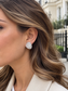 Model wearing Geneva Baguette Crystal Earrings by Valoria London
