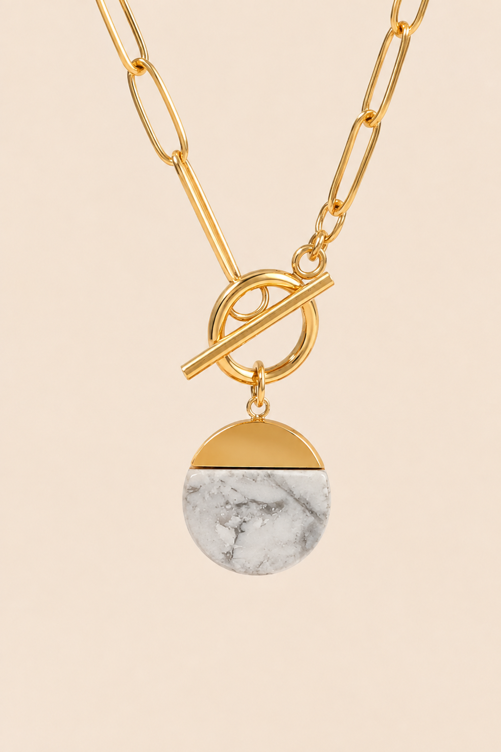 Ivory Aurelia gold paperclip toggle necklace with white marble-effect pendant
