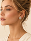 Model wearing Lumière silver crystal burst stud earrings