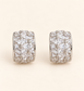 Milan Crystal Huggie Earrings with multi-cut crystals on soft ivory cream background