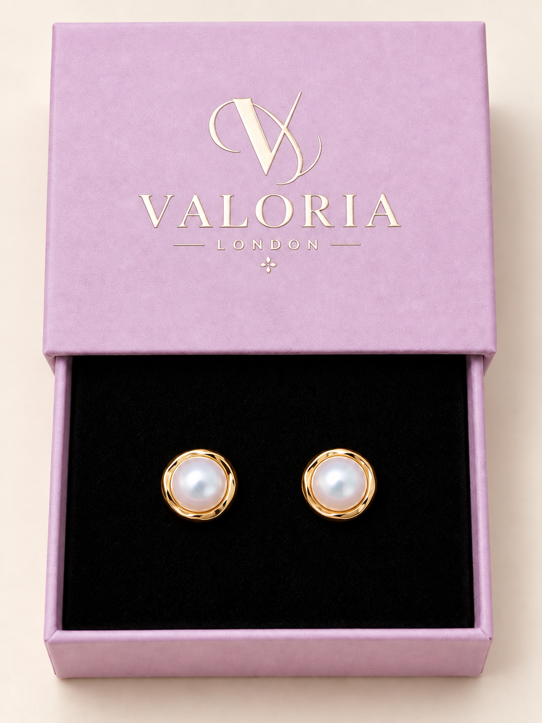 Pearl Glow gold-tone pearl stud earrings presented in a Valoria London jewellery box.