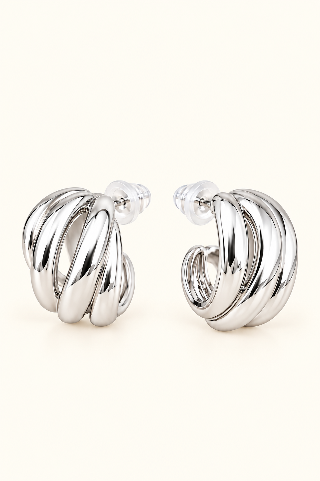Sienna Sculpted silver hoop earrings on soft ivory cream background
