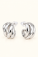 Sienna Sculpted silver hoop earrings on soft ivory cream background