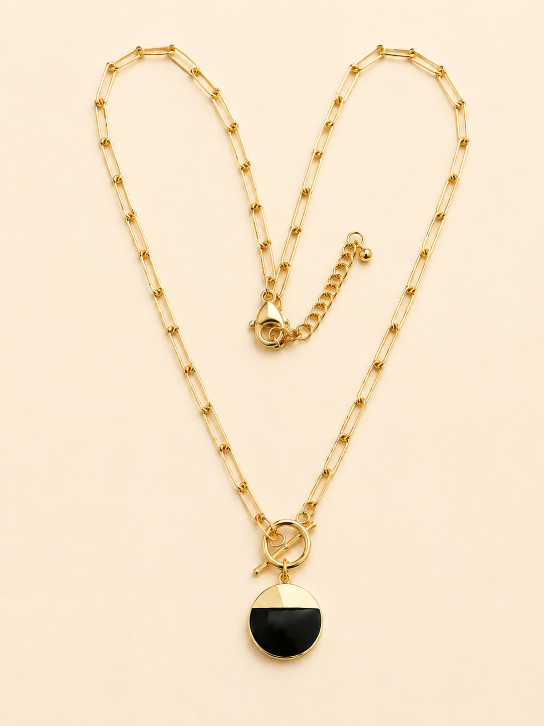 Black and gold 18K gold-plated paperclip chain necklace with circular statement pendant