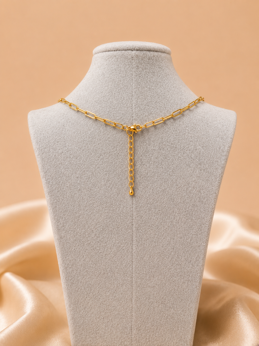 Back view of the Valoria London Celeste gold paperclip chain necklace showing the lobster clasp and adjustable extender chain