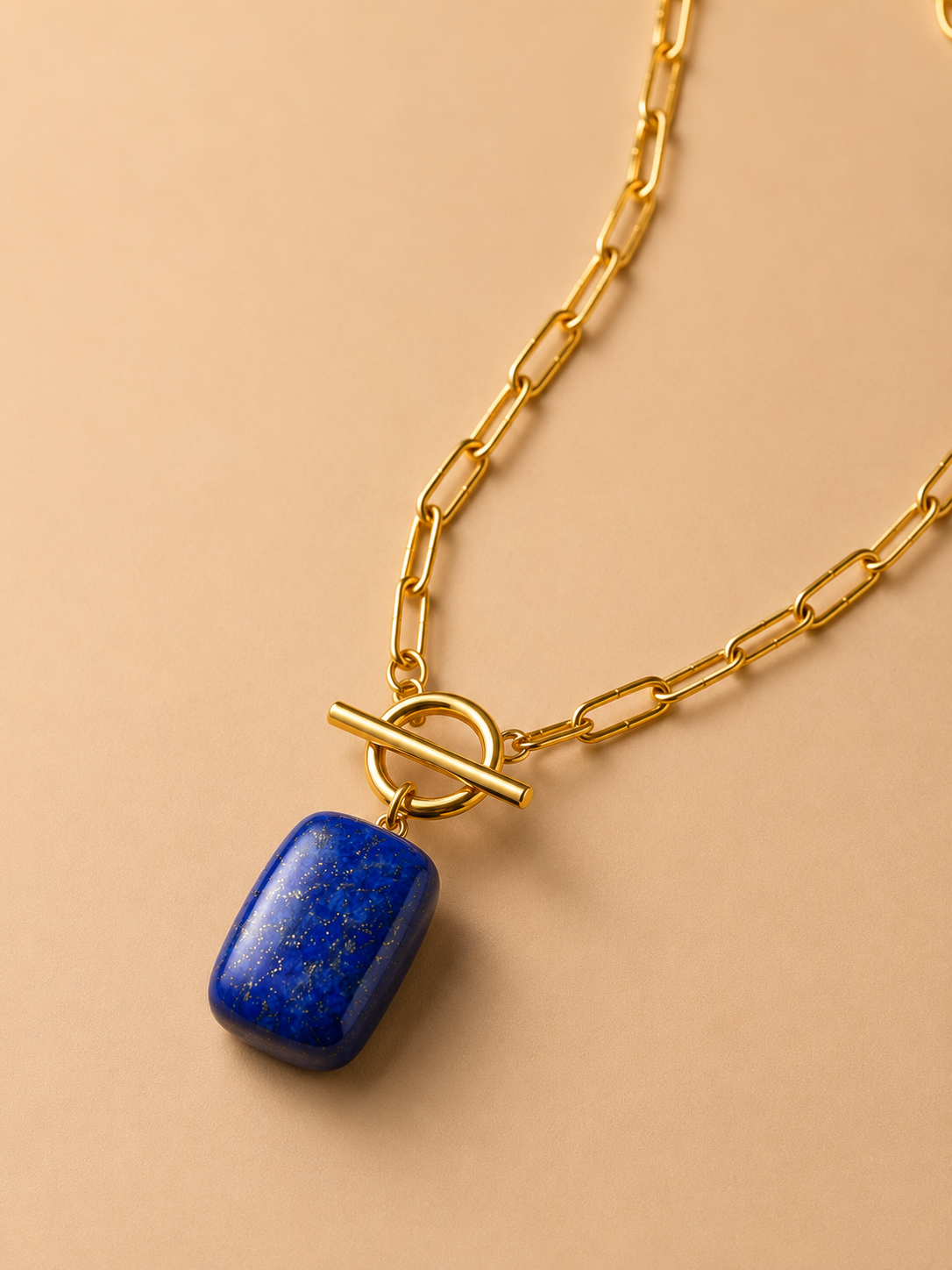 Valoria London Celeste gold paperclip chain necklace with toggle clasp and deep blue rectangular stone pendant