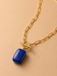 Valoria London Celeste gold paperclip chain necklace with toggle clasp and deep blue rectangular stone pendant