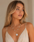 Valoria London gold layered pearl necklace with round pearl pendant and floating pearls – front view