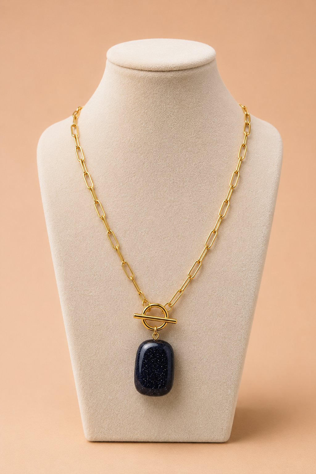 Valoria London black pendant necklace displayed on a cream jewellery mannequin