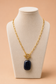 Valoria London black pendant necklace displayed on a cream jewellery mannequin