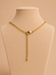 Purple Radiance gold paperclip chain and necklace fastening detail